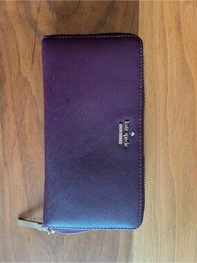 kate spade purple zip-around leather wallet with gold logo